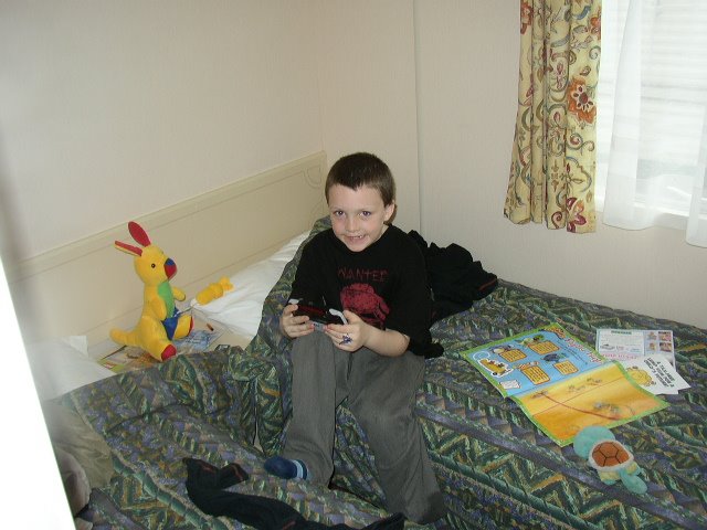 Picture of young Riley playing a GBA