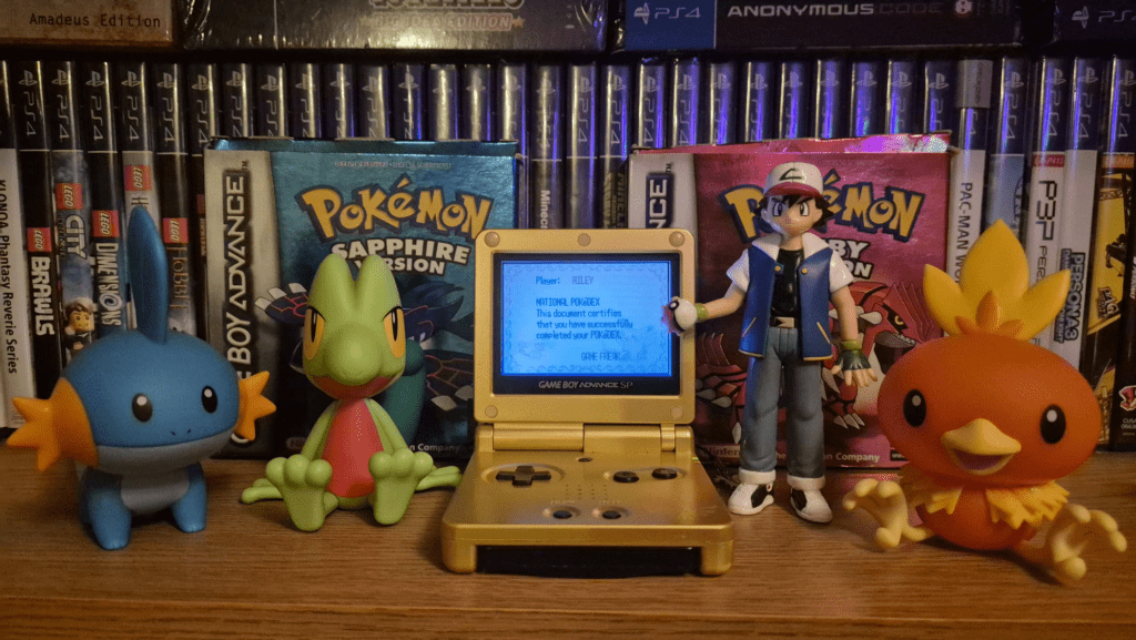 a photo of Ruby, Sapphire a GBA SP and the Hoenn starters
